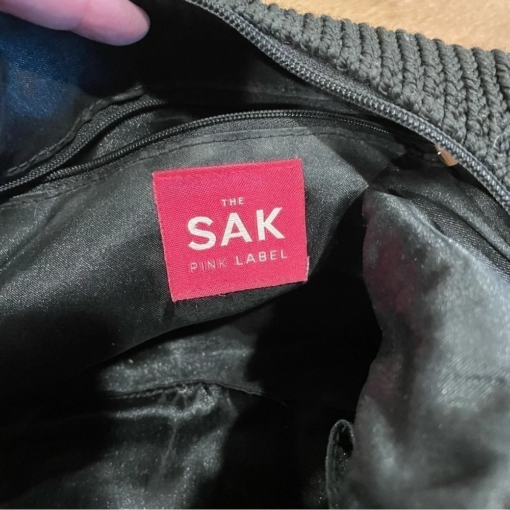 The sak pink label bag Black with Brown trim